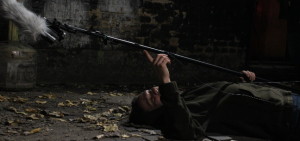 Sound Guy on his Back in an Alley